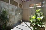 Kohala and Kona downstairs suites have large showers with a screened-in ceiling